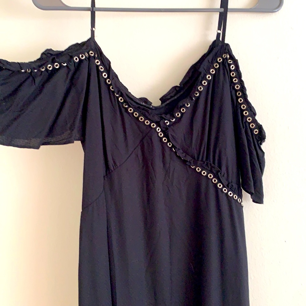 Asymmetrical black shoulder dress with pirate hem